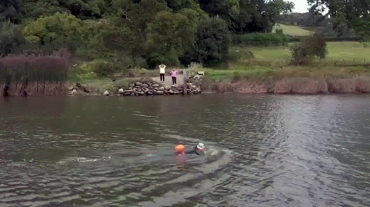 Gareth swims Afon Conwy- with support from the banks
