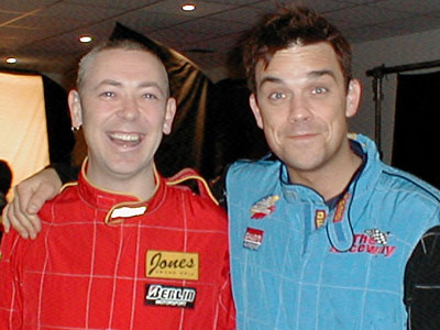 One of these two is one of the coolest men in the world, and the other is Robbie Williams.